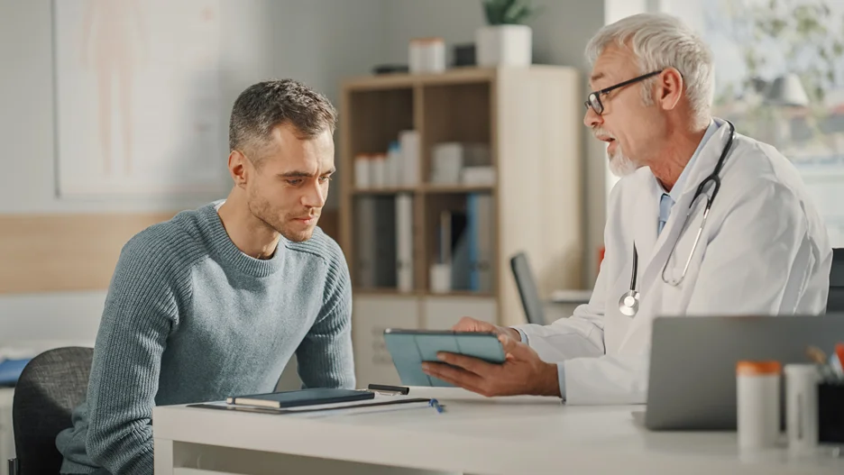a man consults his doctor with regards to testosterone therapy