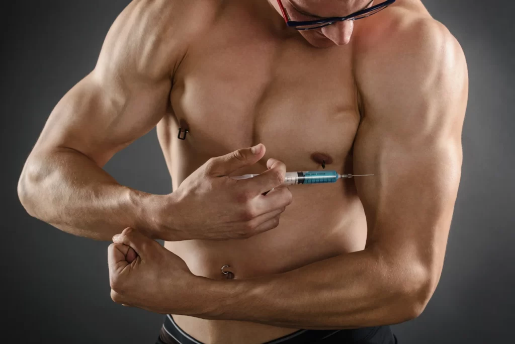 a man injects testosterone therapy into his muscle