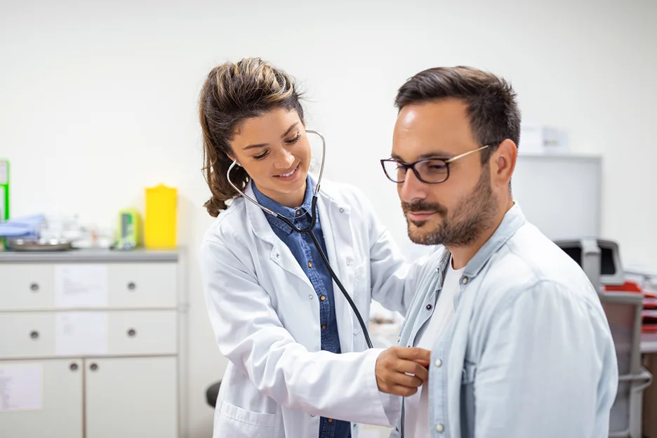 a doctor checks the overall health of the patient