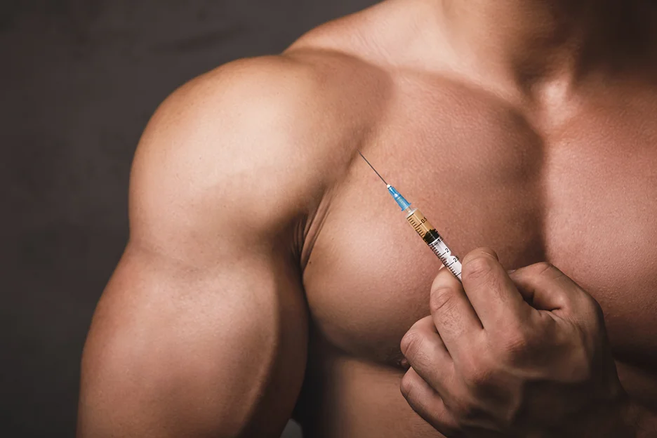 a man holding testosterone replacement therapy injection