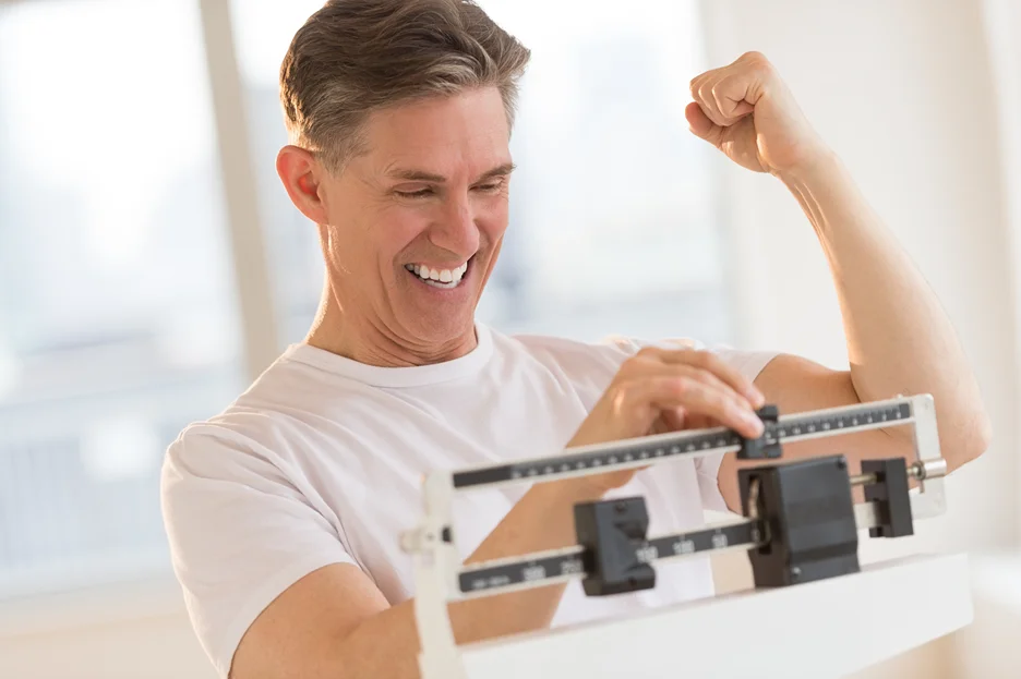 man uses weight scale 