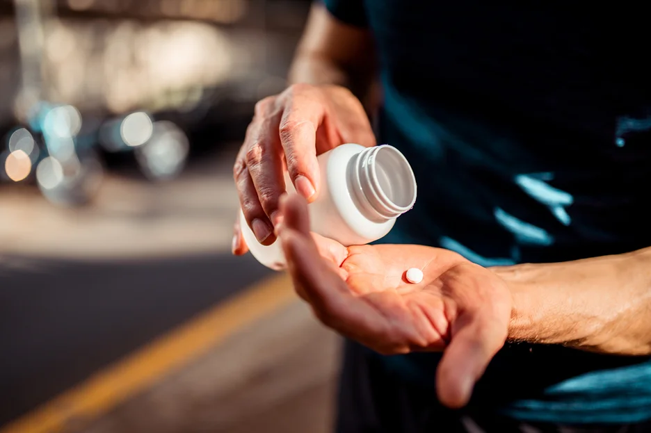 man taking a pill